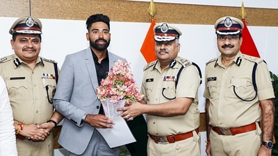 Telangana Director General of Police Jitender hands over appointment letters to Indian Cricketer Mohammed Siraj as Deputy Superintendent of Police, at DGP office in Hyderabad on Friday. (ANI) Telangana Director General of Police Jitender hands over appointment letters to Indian Cricketer Mohammed Siraj as Deputy Superintendent of Police, at DGP office in Hyderabad on Friday. (ANI)