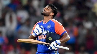 India's Sanju Samson celebrates after scoring a century (100 runs) during the third and final Twenty20 international cricket match between India and Bangladesh (AFP)