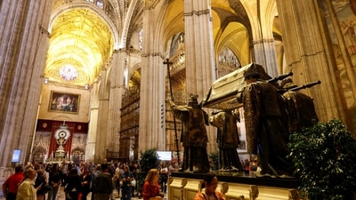 People visit the mausoleum of Christopher Columbus in the cathedral of Seville, Spain. (REUTERS)