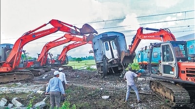 Cranes lift the wrecked coaches as track restoration works begins after 12 coaches of Mysuru-Darbhanga Bagmati Superfast Express derailed by colliding with a stationary goods train at Chennai-Guddur section between Ponneri- Kavarappettai railway stations, on Saturday. At least 19 passengers were injured in the incident. (ANI)
