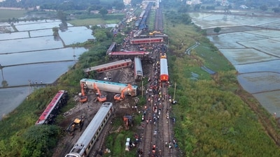 Restoration work underway after an express train rammed into a stationary train on Friday, at Kavarapettai in Tiruvallur district, Saturday, Oct. 12. (PTI)