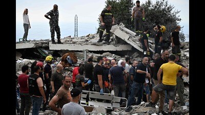 People inspect the damage at the site of an Israeli airstrike on the Mount Lebanon village of Maaysra, east of the coastal town of Byblos, on October 12, 2024. (Photo by JOSEPH EID / AFP) (AFP) People inspect the damage at the site of an Israeli airstrike on the Mount Lebanon village of Maaysra, east of the coastal town of Byblos, on October 12, 2024. (Photo by JOSEPH EID / AFP) (AFP)