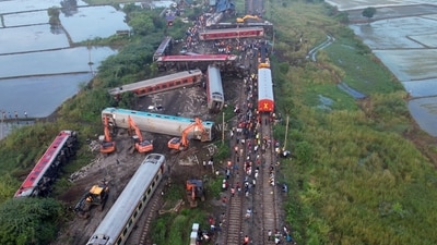 Restoration work underway after an express train rammed into a stationary train on Friday, at Kavaraipettai. (PTI) Restoration work underway after an express train rammed into a stationary train on Friday, at Kavaraipettai. (PTI)