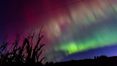 Another in a series of unusually strong solar storms hitting Earth produced stunning skies full of pinks, purples, greens and blues farther south than normal, including into parts of Germany, the United Kingdom, New England and New York City. (REUTERS)