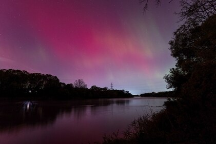 Aurora Borealis illuminate the sky in Haldimand County,Ontario, Canada, October 10, 2024. (REUTERS/Carlos Osorio)