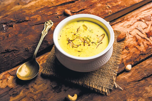 A serving of rabri, topped with saffron strands. It takes about 1.5 lakh flowers to produce 1 kg of dried saffron. (Adobe Stock) A serving of rabri, topped with saffron strands. It takes about 1.5 lakh flowers to produce 1 kg of dried saffron. (Adobe Stock)