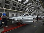 Employees work on an electric vehicle (EV) production line at the Leapmotor factory in Jinhua, China's eastern Zhejiang province on September 18, 2024. china's Leapmotor and Stellantis are set to start taking orders in Europe for the T03 electric city car, the group announced on September 24, 2024. Employees work on an electric vehicle (EV) production line at the Leapmotor factory in Jinhua, China's eastern Zhejiang province on September 18, 2024. china's Leapmotor and Stellantis are set to start taking orders in Europe for the T03 electric city car, the group announced on September 24, 2024.