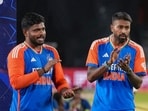 Hardika Pandya and Sanju Samson applauds during the presentation ceremony after winning the third and final T20 International cricket match between India and Bangladesh 