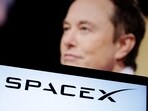 SpaceX logo and Elon Musk photo are seen in this illustration.