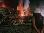 A person stands by damages at the site of an Israeli airstrike that targeted the southern Lebanese city of Nabatiyeh on October 12, 2024. A person stands by damages at the site of an Israeli airstrike that targeted the southern Lebanese city of Nabatiyeh on October 12, 2024.