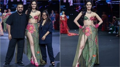 Manushi Chhillar turned showstopper for Rishi & Vibhuti. She walked the ramp in a stunning green bralette adorned with pink roses. She paired it with a matching thigh-high slit skirt and bright pink high heels. (Instagram) Manushi Chhillar turned showstopper for Rishi & Vibhuti. She walked the ramp in a stunning green bralette adorned with pink roses. She paired it with a matching thigh-high slit skirt and bright pink high heels. (Instagram)