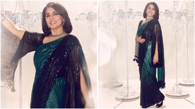 Her stunning look in a dual-tone Manish Malhotra saree is all about glitz and glamour. The gorgeous black and green shades, combined with shimmer detailing throughout, make it a complete showstopper. (Instagram/@neetu54) Her stunning look in a dual-tone Manish Malhotra saree is all about glitz and glamour. The gorgeous black and green shades, combined with shimmer detailing throughout, make it a complete showstopper. (Instagram/@neetu54)
