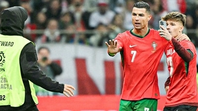 Cristiano Ronaldo protects a fan. Cristiano Ronaldo protects a fan.