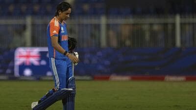 India skipper Harmanpreet Kaur walks off after the defeat to Australia in the ICC Women's T20 World Cup at the Sharjah Stadium on Sunday. (AP) India skipper Harmanpreet Kaur walks off after the defeat to Australia in the ICC Women's T20 World Cup at the Sharjah Stadium on Sunday. (AP)