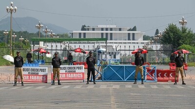 Security personnel stand guard in front of the Presidential Palace ahead of a Shanghai Cooperation Organisation (SCO) summit in Islamabad on October 13, 2024. Pakistan authorities were on October 13 preparing to shut down the capital ahead of a Shanghai Cooperation Organisation summit, overshadowed by recent militant violence and political unrest. (Photo by Aamir QURESHI / AFP) (AFP) Security personnel stand guard in front of the Presidential Palace ahead of a Shanghai Cooperation Organisation (SCO) summit in Islamabad on October 13, 2024. Pakistan authorities were on October 13 preparing to shut down the capital ahead of a Shanghai Cooperation Organisation summit, overshadowed by recent militant violence and political unrest. (Photo by Aamir QURESHI / AFP) (AFP)