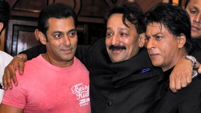 Then Congress leader Baba Siddique with actors Salman Khan and Shah Rukh Khan during an Iftar party in Mumbai in 2013. (PTI file) Then Congress leader Baba Siddique with actors Salman Khan and Shah Rukh Khan during an Iftar party in Mumbai in 2013. (PTI file)
