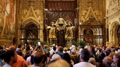 People visit the mausoleum of Christopher Columbus in the cathedral of Seville, Spain October 11, 2024. (REUTERS/Marcelo del PozoRS)