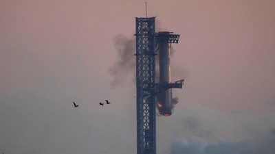 SpaceX's mega rocket booster returns to the launch pad to be captured during a test flight Sunday, Oct. 13, 2024, in Boca Chica,, Texas. (AP Photo/Eric Gay) (AP) SpaceX's mega rocket booster returns to the launch pad to be captured during a test flight Sunday, Oct. 13, 2024, in Boca Chica,, Texas. (AP Photo/Eric Gay) (AP)