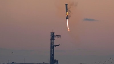 SpaceX's mega rocket booster returns to the launch pad to be captured during a test flight, Sunday, Oct. 13, 2024, in Boca Chica,, Texas. (AP Photo/Eric Gay) (AP) SpaceX's mega rocket booster returns to the launch pad to be captured during a test flight, Sunday, Oct. 13, 2024, in Boca Chica,, Texas. (AP Photo/Eric Gay) (AP)