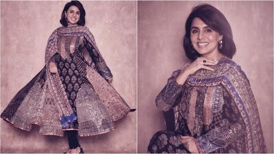 She looks absolutely glamorous in a stunning black Anarkali adorned with traditional block prints and golden embellishments. Paired with a matching dupatta and black leggings, she exudes effortless glamour. (Instagram/@neetu54) She looks absolutely glamorous in a stunning black Anarkali adorned with traditional block prints and golden embellishments. Paired with a matching dupatta and black leggings, she exudes effortless glamour. (Instagram/@neetu54)