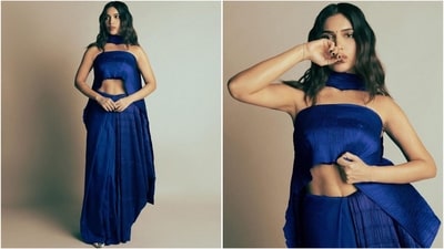 Bhumi Pednekar is here to show you how to wear a saree this festive season with a contemporary twist. The 35-year-old actor is known for her daring and experimental style, and her ensembles often create quite a buzz in fashion circles. Her latest look in modern blue six-yards is no exception and is sure to leave you in awe. (Instagram/@bhumipednekar) Bhumi Pednekar is here to show you how to wear a saree this festive season with a contemporary twist. The 35-year-old actor is known for her daring and experimental style, and her ensembles often create quite a buzz in fashion circles. Her latest look in modern blue six-yards is no exception and is sure to leave you in awe. (Instagram/@bhumipednekar)