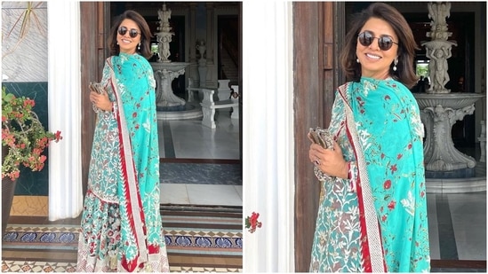 Her kurta set exudes royalty as she dons a sky-blue kurta with intricate white embroidery, paired with a matching skirt. Styled with a printed dupatta, she effortlessly rocks the traditional look.(Instagram/@neetu54)