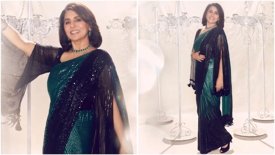 Her stunning look in a dual-tone Manish Malhotra saree is all about glitz and glamour. The gorgeous black and green shades, combined with shimmer detailing throughout, make it a complete showstopper.(Instagram/@neetu54)