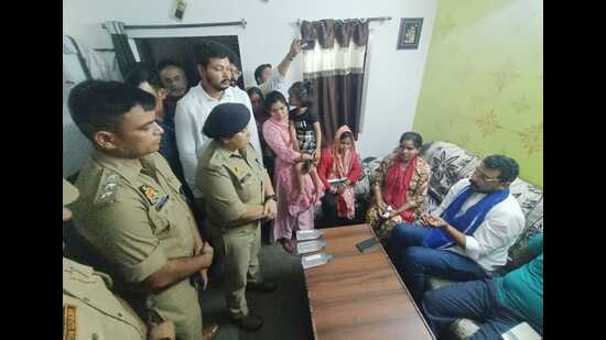 Nagina MP Chandra Shekhar Azad with the family of Dalit man Aman Gautam who died in a police van in Lucknow. (Deepak Gupta/HT)