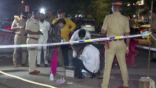 Forensic team investigates at the site where former Maharashtra minister Baba Siddique was shot dead by three assailants, in Mumbai, on Saturday night. (PTI)