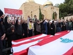 In Lebanon, mourners attend a funeral for the victims of an Israeli airstrike in the Mount Lebanon village of Maaysra, east of the coastal town of Byblos, on October 14, 2024. In Lebanon, mourners attend a funeral for the victims of an Israeli airstrike in the Mount Lebanon village of Maaysra, east of the coastal town of Byblos, on October 14, 2024.