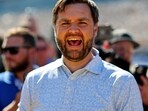 Oct 13, 2024; Concord, North Carolina, USA; Republican vice presidential nominee JD Vance (R-OH) laughs on the grid before the Bank of America ROVAL 400 at Charlotte Motor Speedway Road Course. Mandatory Credit: Peter Casey-Imagn Images