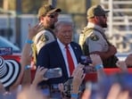 Riverside Country Sheriffs stand guard as Republican presidential nominee and former U.S. President Donald Trump arrives at his rally in Coachella, California, U.S., October 12, 2024.  REUTERS/Mike Blake