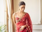 Alia Bhatt looks dazzling in the sindoori red saree. Alia Bhatt looks dazzling in the sindoori red saree.