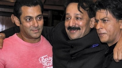 **EDS: FILE IMAGE** Mumbai: In this Sunday, July 21, 2013 file photo, then Congress leader Baba Siddique with actors Salman Khan and Shah Rukh Khan during an Iftar party, in Mumbai. Three unidentified persons fired at and injured Baba Siddiqui of the Ajit Pawar-led NCP in Mumbai's Bandra East on Saturday evening. (PTI Photo) (PTI10_12_2024_000458A) (PTI) **EDS: FILE IMAGE** Mumbai: In this Sunday, July 21, 2013 file photo, then Congress leader Baba Siddique with actors Salman Khan and Shah Rukh Khan during an Iftar party, in Mumbai. Three unidentified persons fired at and injured Baba Siddiqui of the Ajit Pawar-led NCP in Mumbai's Bandra East on Saturday evening. (PTI Photo) (PTI10_12_2024_000458A) (PTI)