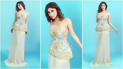 Mouni Roy rocks a beautiful pastel look featuring an off-shoulder floral-embellished top, styled with a pleated maxi skirt. With curled tresses and soft dewy makeup, she looks straight out of a fairytale. (Instagram) Mouni Roy rocks a beautiful pastel look featuring an off-shoulder floral-embellished top, styled with a pleated maxi skirt. With curled tresses and soft dewy makeup, she looks straight out of a fairytale. (Instagram)