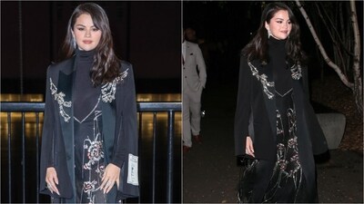 Selena Gomez looks absolutely glamorous in a black turtleneck gown adorned with sequin floral embroidery. Paired with a matching blazer and dangling diamond earrings, she looks stunning. (Instagram) Selena Gomez looks absolutely glamorous in a black turtleneck gown adorned with sequin floral embroidery. Paired with a matching blazer and dangling diamond earrings, she looks stunning. (Instagram)