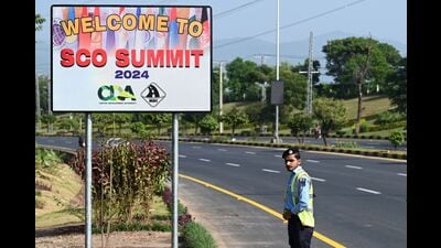 A policeman stands guard at the Red Zone near a venue on the eve of the Shanghai Cooperation Organisation (SCO) summit in Islamabad on October 14, 2024. (Photo by Aamir QURESHI / AFP) (AFP)