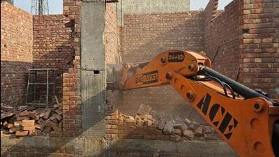 An illegal structure being demolished in Ludhiana on Monday. (HT Photo)