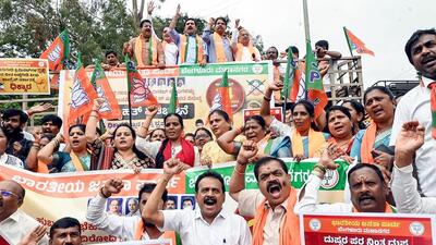 Karnataka BJP president BY Vijayendra along with Leader of Opposition in Karnataka Assembly R Ashoka, party leader Ashwath Narayan and others stage a protest against the Karnataka government's decision to withdraw the 2022 Hubballi riots case against AIMIM leaders, in Bengaluru on Monday. (ANI) Karnataka BJP president BY Vijayendra along with Leader of Opposition in Karnataka Assembly R Ashoka, party leader Ashwath Narayan and others stage a protest against the Karnataka government's decision to withdraw the 2022 Hubballi riots case against AIMIM leaders, in Bengaluru on Monday. (ANI)