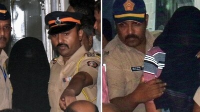Police personnel escort the two accused to be produced at Esplanade Court in connection with the killing of NCP leader Baba Siddique, in Mumbai on Sunday. (ANI) Police personnel escort the two accused to be produced at Esplanade Court in connection with the killing of NCP leader Baba Siddique, in Mumbai on Sunday. (ANI)