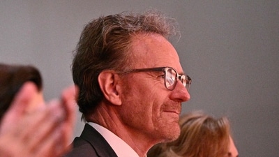 Actor Bryan Cranston (R) listens to US President Joe Biden speak during a commemoration of the 60th anniversary of the Civil Rights Acts at the Lyndon B. Johnson presidential library in Austin, Texas, on July 29, 2024. (Photo by Brendan SMIALOWSKI / AFP) (AFP) Actor Bryan Cranston (R) listens to US President Joe Biden speak during a commemoration of the 60th anniversary of the Civil Rights Acts at the Lyndon B. Johnson presidential library in Austin, Texas, on July 29, 2024. (Photo by Brendan SMIALOWSKI / AFP) (AFP)