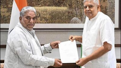 Vice-President Jagdeep Dhankhar (right) receiving the resignation letter of Rajya Sabha member Krishan Lal Panwar in New Delhi on Monday. (PTI Photo)