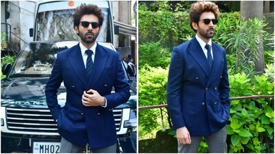 Kartik Aaryan looks absolutely dapper in a navy blue blazer, styled with a crisp white shirt, blue striped tie, and grey pants. With black sunglasses and perfectly gelled hair, he finished off his classy look. (Instagram) Kartik Aaryan looks absolutely dapper in a navy blue blazer, styled with a crisp white shirt, blue striped tie, and grey pants. With black sunglasses and perfectly gelled hair, he finished off his classy look. (Instagram)