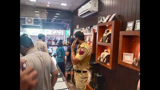 A police official at the scene of the crime at Lohgarh in Zirakpur on Monday. (HT Photo)