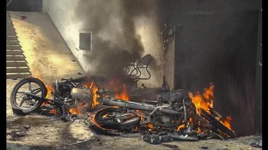 Bikes burnt following Sunday night violence during Durga idol immersion in Bahraich. (PTI Photo)