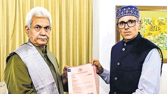 Omar Abdullah hands letters of support to J&K LG Manoj Sinha at Raj Bhawan in Srinagar on Friday. (PTI)