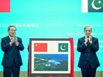 In this handout photograph taken on October 14, 2024, and released by Pakistan's Prime Minister Office, China's Premier Li Qiang (L) and Pakistan's Prime Minister Shehbaz Sharif gesture after unveiling a plaque to mark the completion of New Gwadar International Airport (NGIA) during a ceremony at the Prime Minister House in Islamabad. China's Premier Li Qiang arrived in Pakistan on October 14, on a four-day bilateral visit leading to the Shanghai Cooperation Organisation (SCO) summit, in Islamabad.
