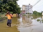 A man crosses a waterlogged street following heavy rains, in Madurai, Tamil Nadu A man crosses a waterlogged street following heavy rains, in Madurai, Tamil Nadu
