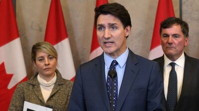 Canadian Prime Minister Justin Trudeau (C), with foreign minister Melanie Joly (L) and public safety minister Dominic LeBlanc speaks during a press conference on October 14, 2024, on Parliament Hill. (AFP) Canadian Prime Minister Justin Trudeau (C), with foreign minister Melanie Joly (L) and public safety minister Dominic LeBlanc speaks during a press conference on October 14, 2024, on Parliament Hill. (AFP)