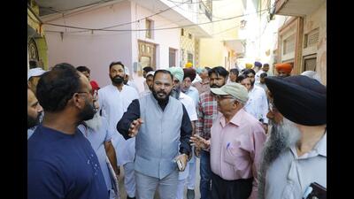 Chandigarh mayor Kuldeep Kumar interacting with locals during his visit to Kajheri village on Tuesday. (HT Photo)